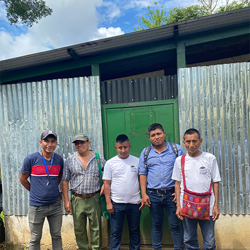 Standing at one of the association facilities Gerardo Coc, Carlos Caal, TBD, Gerber Caal,